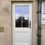 Timber kitchen door with crucifix bars