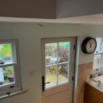 Kitchen with replacement sash windows and timber door