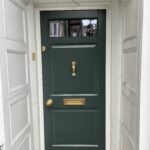 Accoya timber door matched to Farrow & Ball Studio Green with Aged Brass hardware