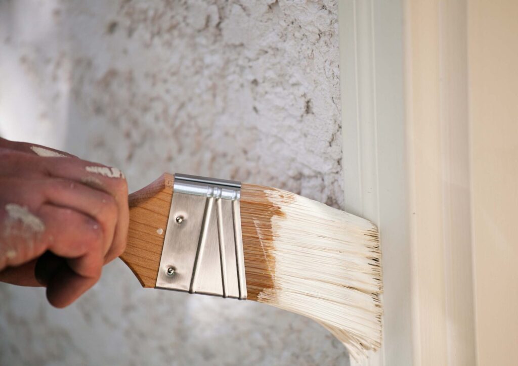 Final coating being applied to a timber frame