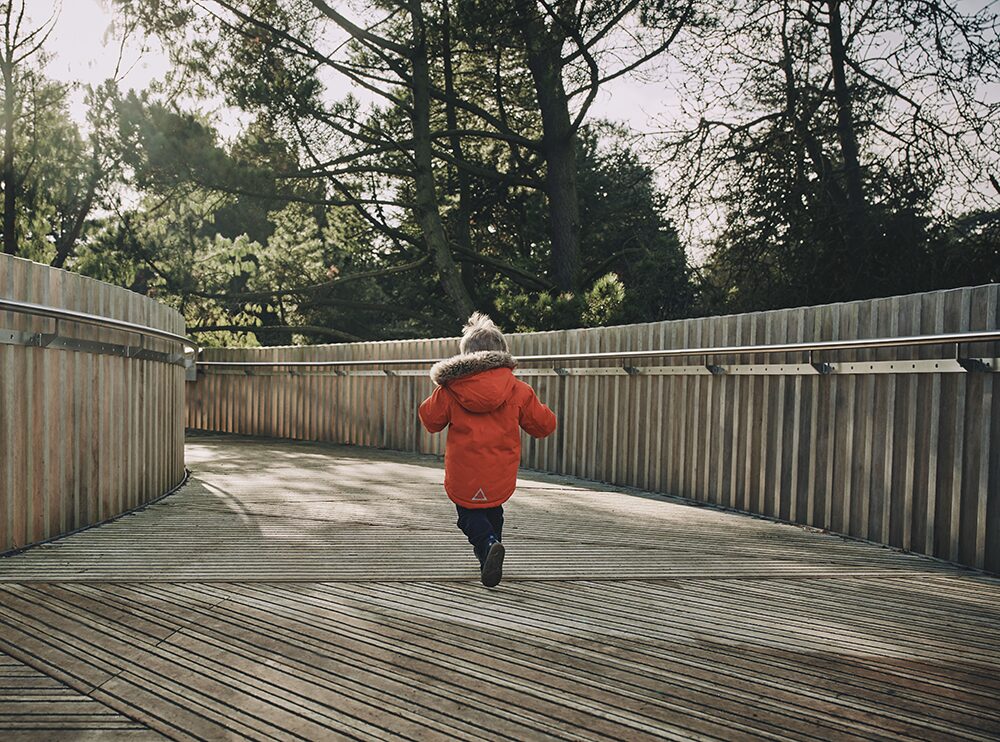 Child running along accoya decking