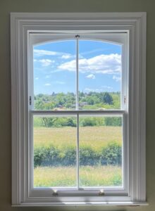 Swept sightline spiral balance window