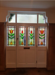 Timber door screen with shaped fanlight