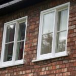 Two timber vertical sliding sash windows in white