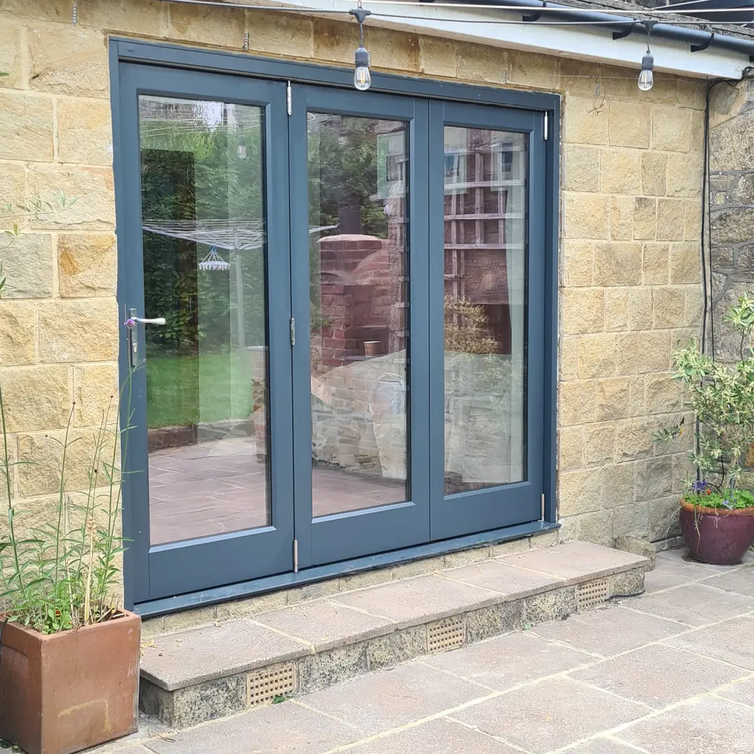 Blue timber bi fold door with three sections