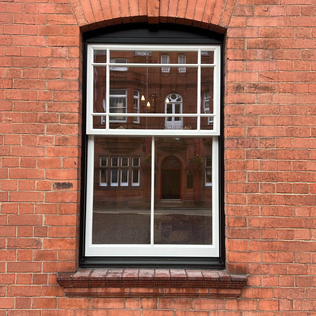 Heritage glazed sliding sash window in an old English terraced house