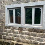 Grey flush casement windows with grey top and bottom sills