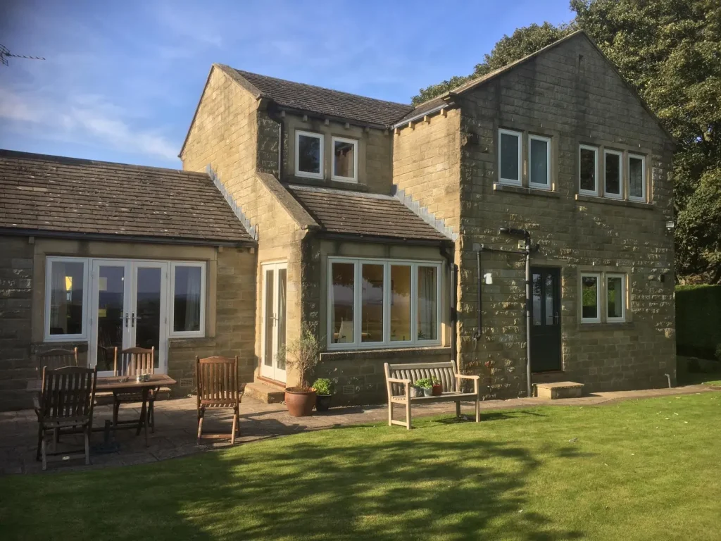 Large house with flush casement windows an double patio doors