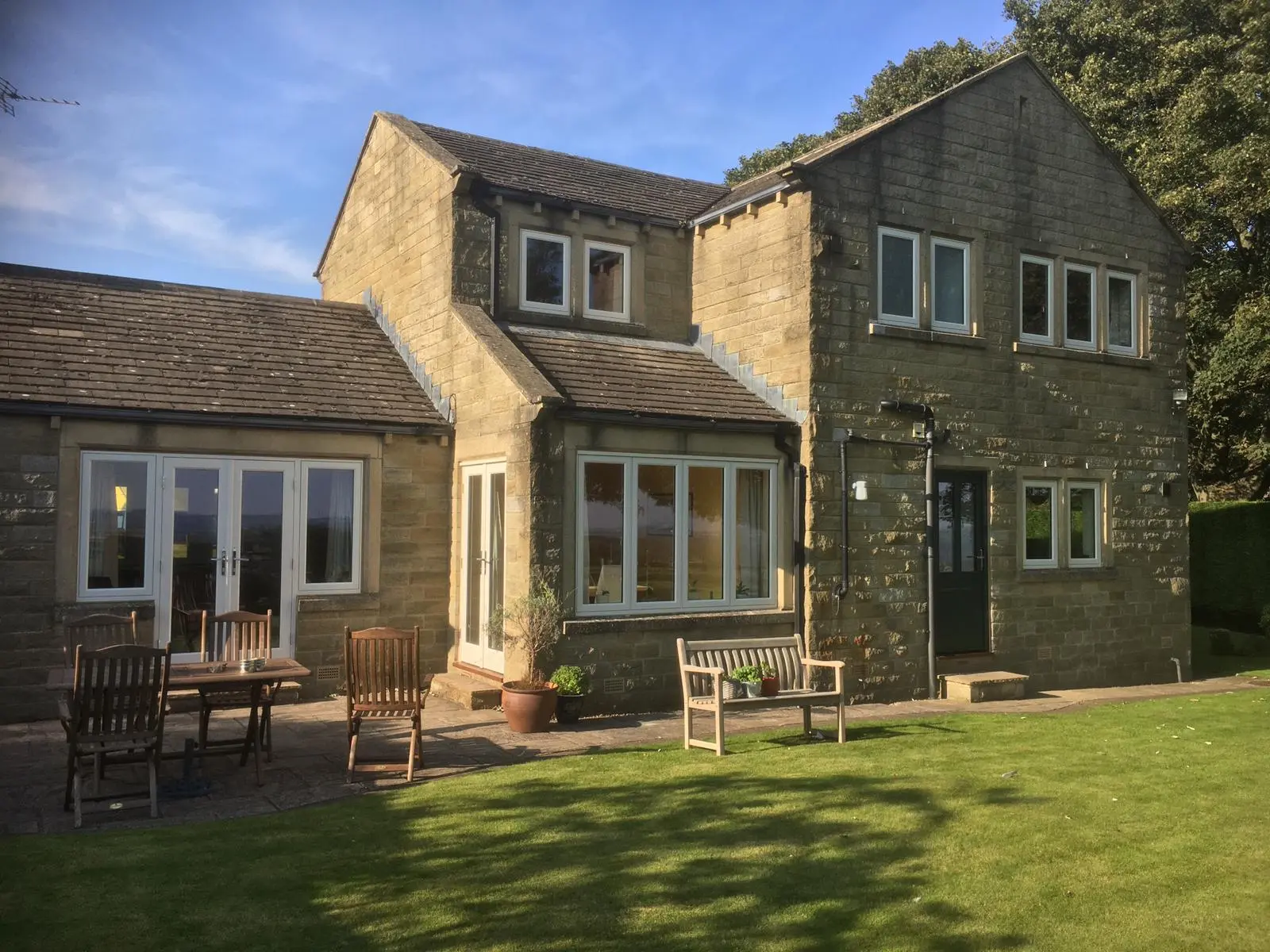 Large house with flush casement windows an double patio doors