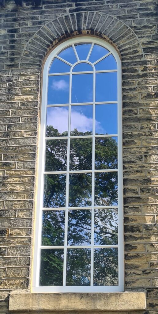 Large arch window with shaped bars