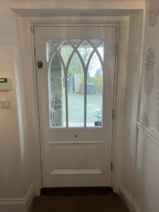 Gothic style front door in white