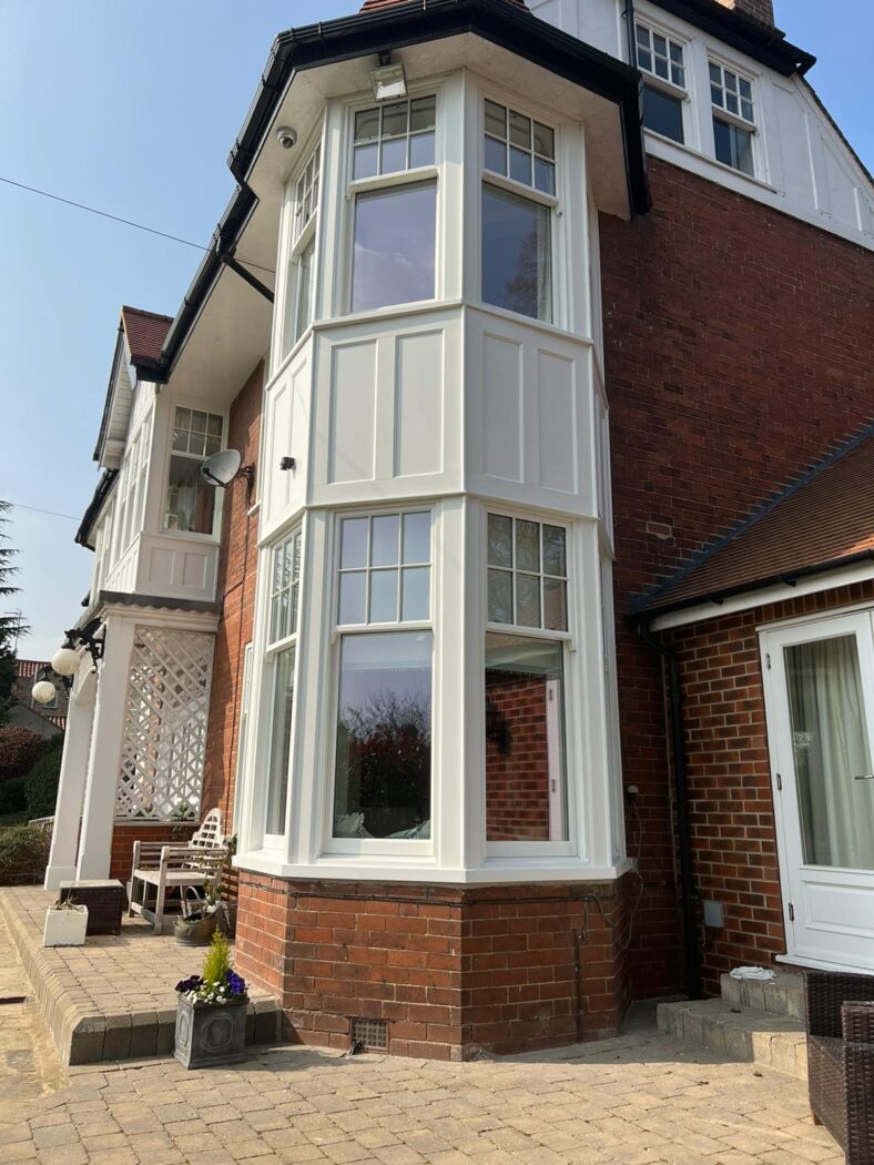 Spiral balance sash windows with bespoke panelling