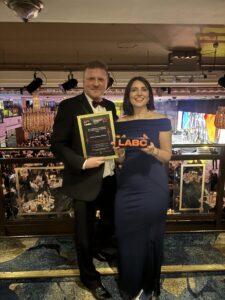 Dave upton and Janine Roberts collecting the LABC Award