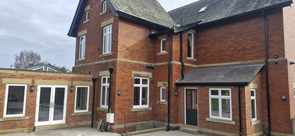 Timber Heritage Flush Casement windows and French doors for a large house on a sunny day