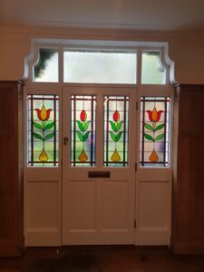 Bespoke timber entrance door with decorative floral glass