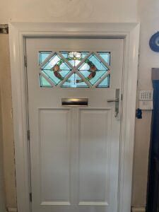 External timber door with encapsulated decorative glass