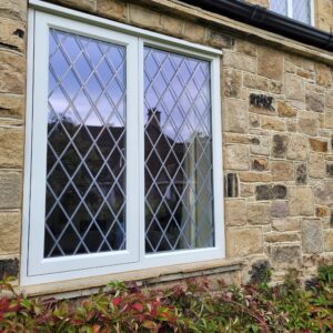 Timber window with diamond leaded glass