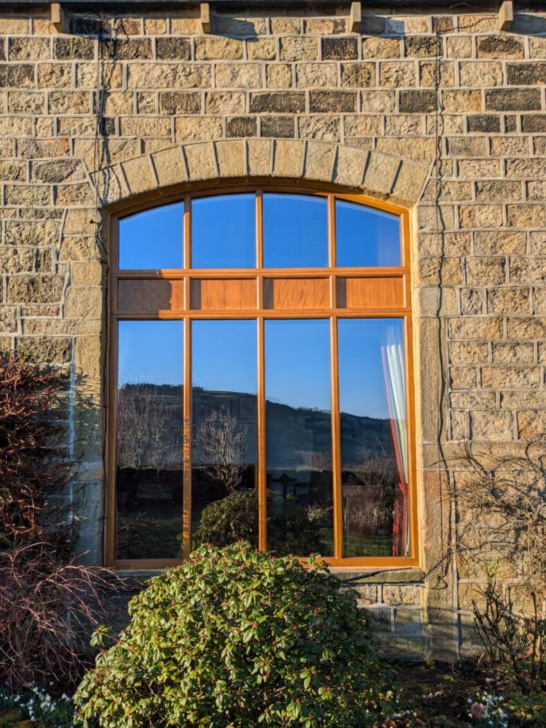Bespoke arched window screen in Light Oak Stain for a barn conversion