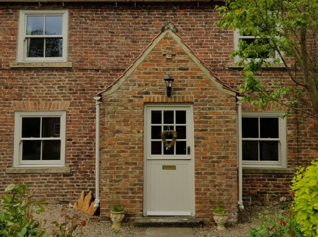 Cottage with a timber stable door with Georgian bars
