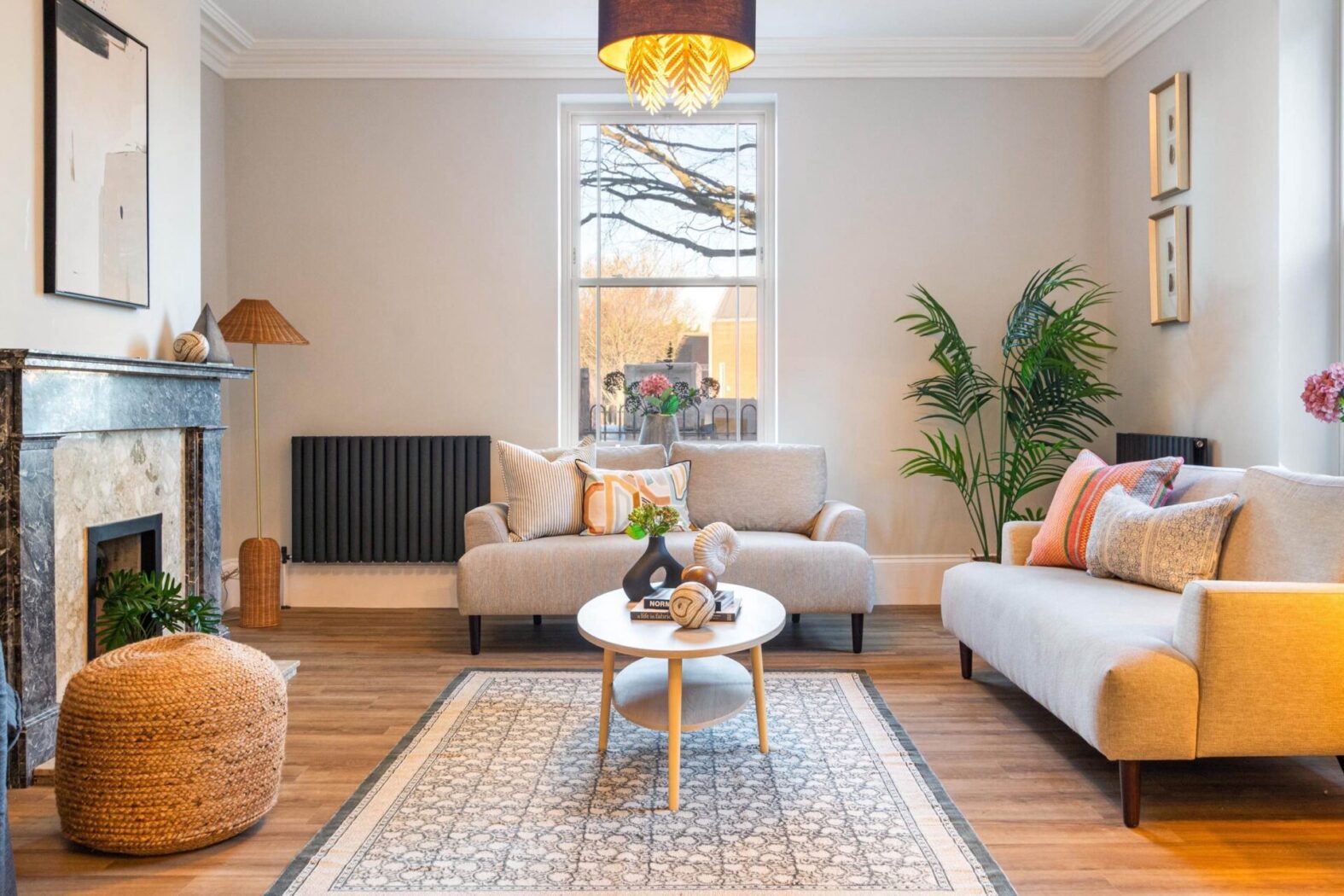 Sliding Sash window at the centre of a modern recently refurbished living room