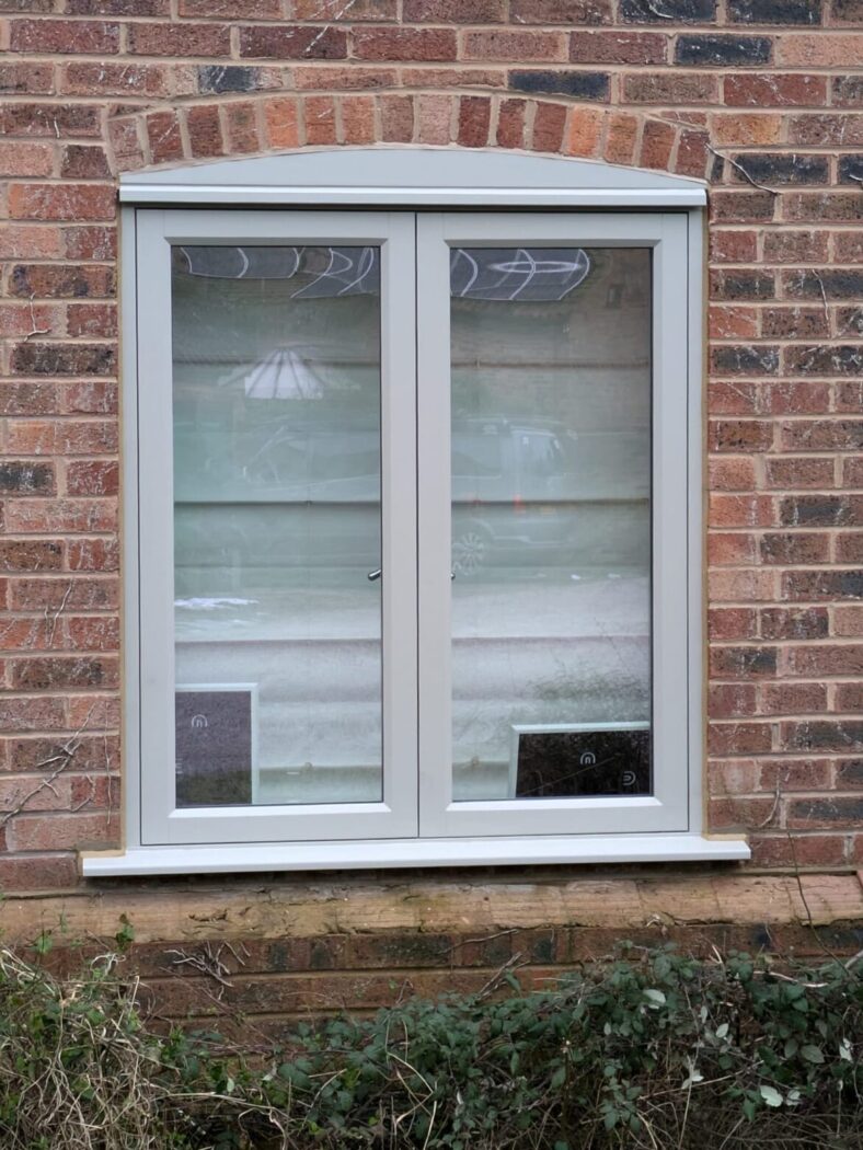 Red brick house with hardwick white flush casement window