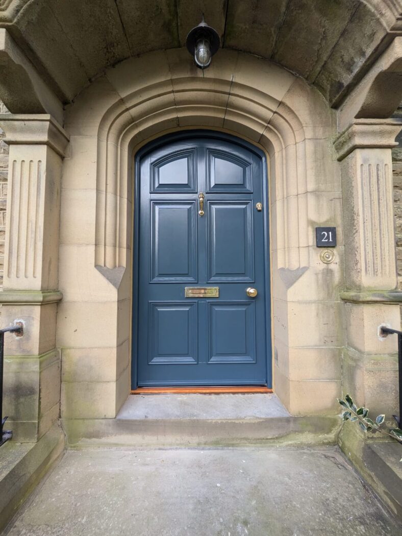 Arched Accoya front door in Hague Blue