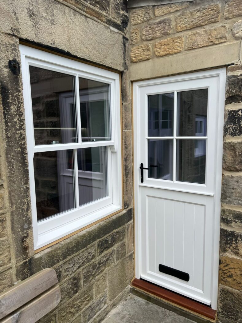 White stable door and matching sliding sash window