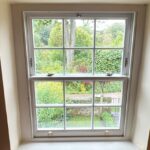 Acooya timber sash window in Shaded White with Georgian bars