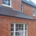 Self build property with white sliding sash windows and a venetian sash window