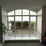 Large feature window with a view looking out over the countryside surrounding Wentworth Woodhouse in South Yorkshire