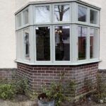 Large replacement bay window crafted from timber in Farrow & Ball Blue Grey