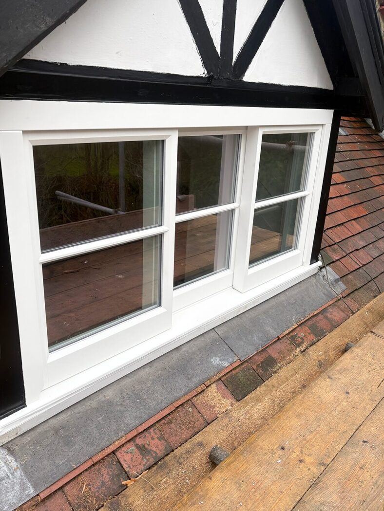 Tudor revival style property with a Yorkshire horizontal sliding sash