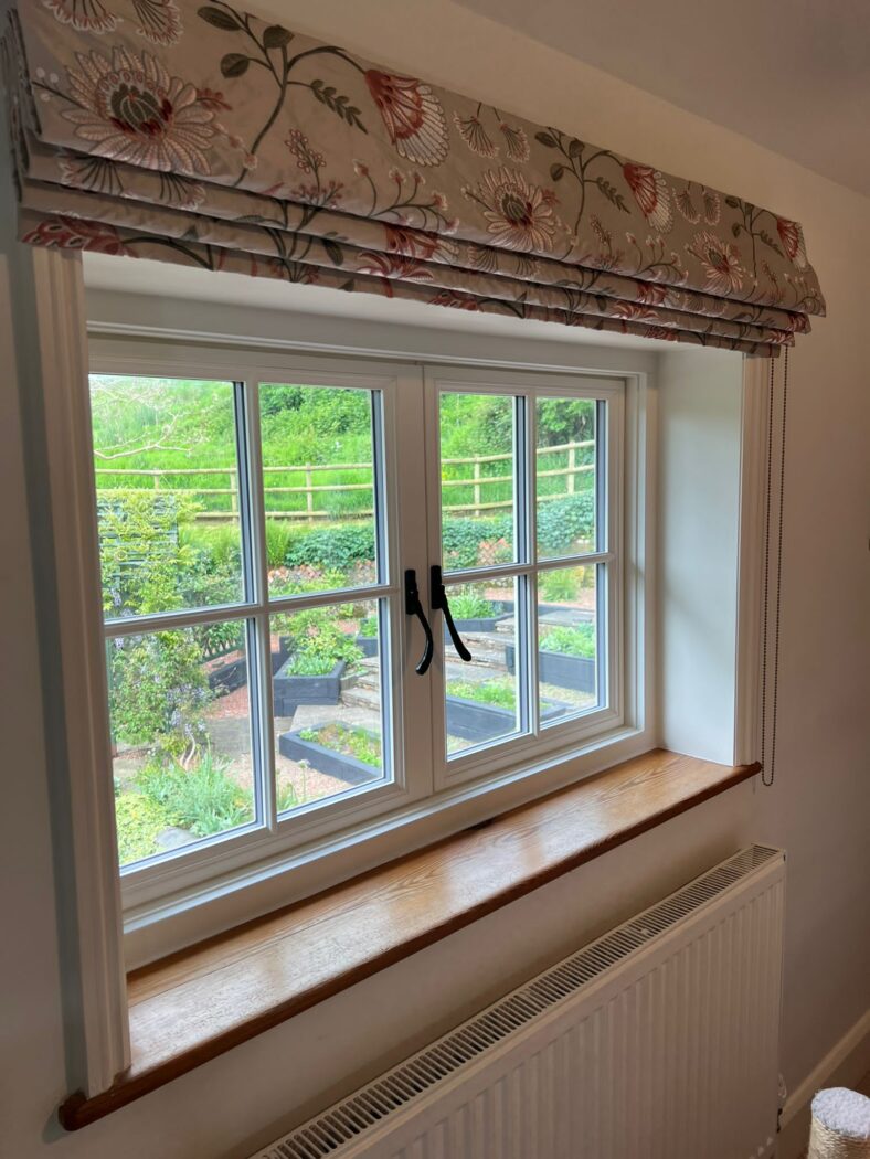 Side angle of a heritage flush casement window with slimmer section sizes and Georgian bars