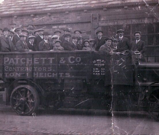 Early 20th century black and white photograph of Patchett Joinery employees in a wagon