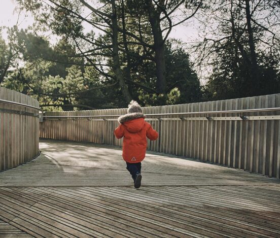 Child running along accoya decking