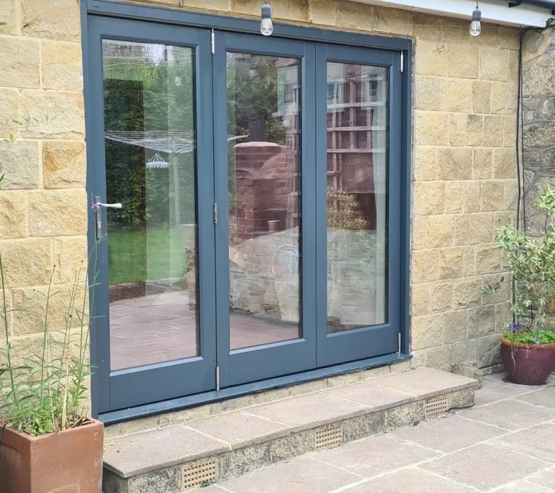 Blue timber bi fold door with three sections