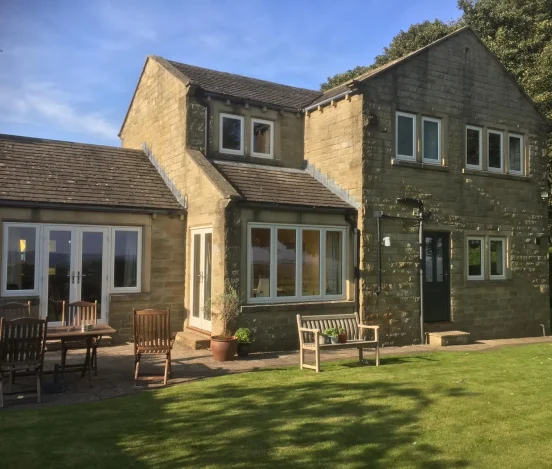 Large house with flush casement windows an double patio doors