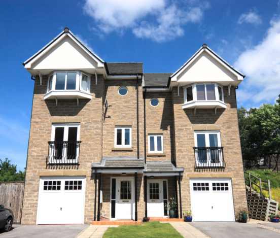 British-style three-story house with casement windows