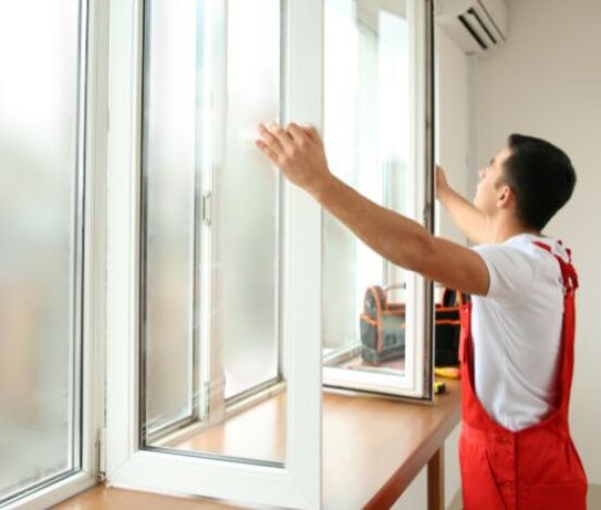 an inspecting double glazed windows in rainy weather.
